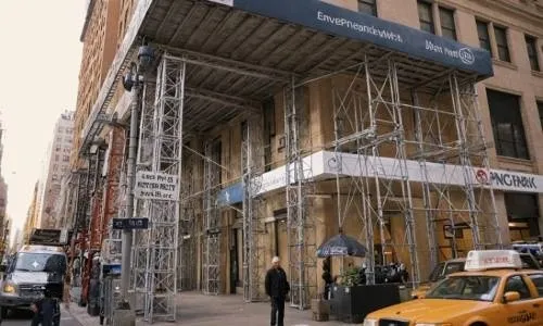 A building with a custom side walk shed