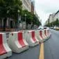 A road with reflective cement barriers