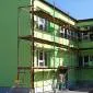 A green mansion with scaffolds 